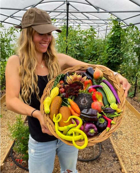 Lucy holding basket of vegetables
